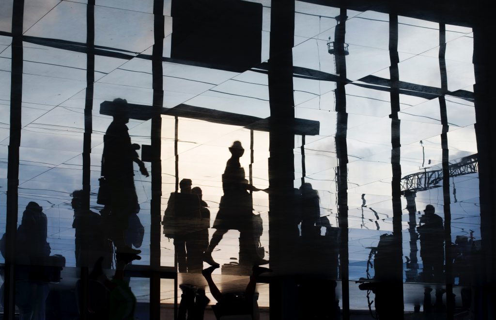 People walking through a company building.